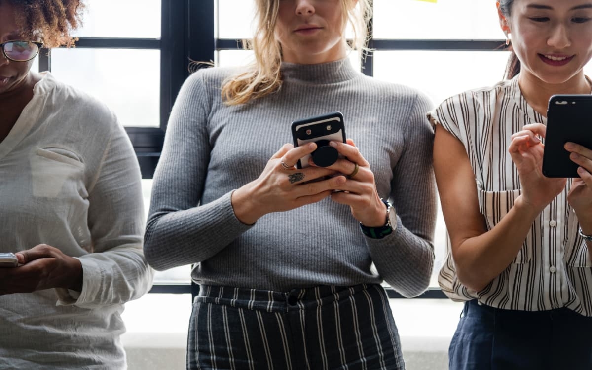 Woman typing on cell phone