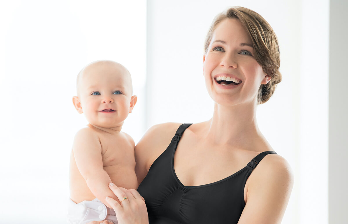 smiling woman with baby
