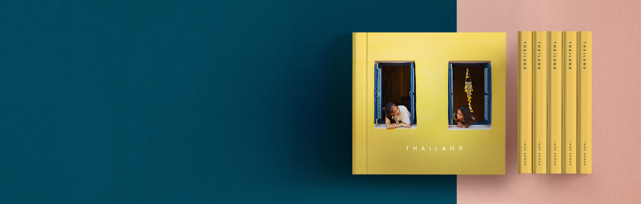 Hardcover book with the words "Thailand" printed on the front in white font against a canary yellow background. The cover photo shows to people smiling at each other while peering out of two windows that have bright blue shutters. 