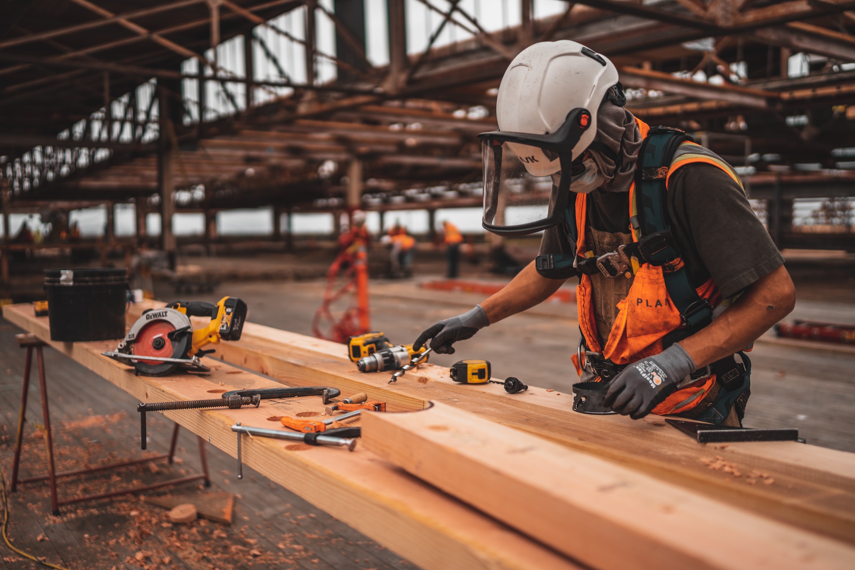 person in construction attire working at construction site