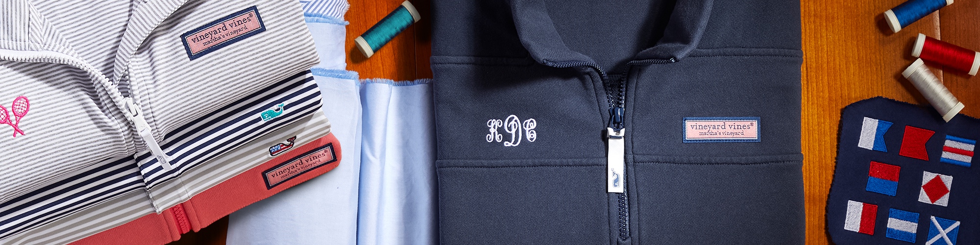 Close up of a navy blue vineyard vines jacket with white monogrammed initials.