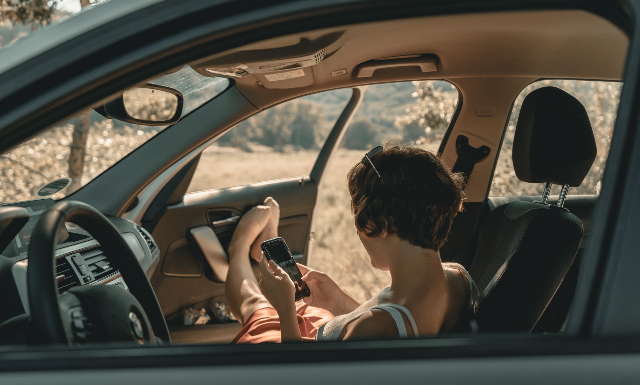 woman using app in car