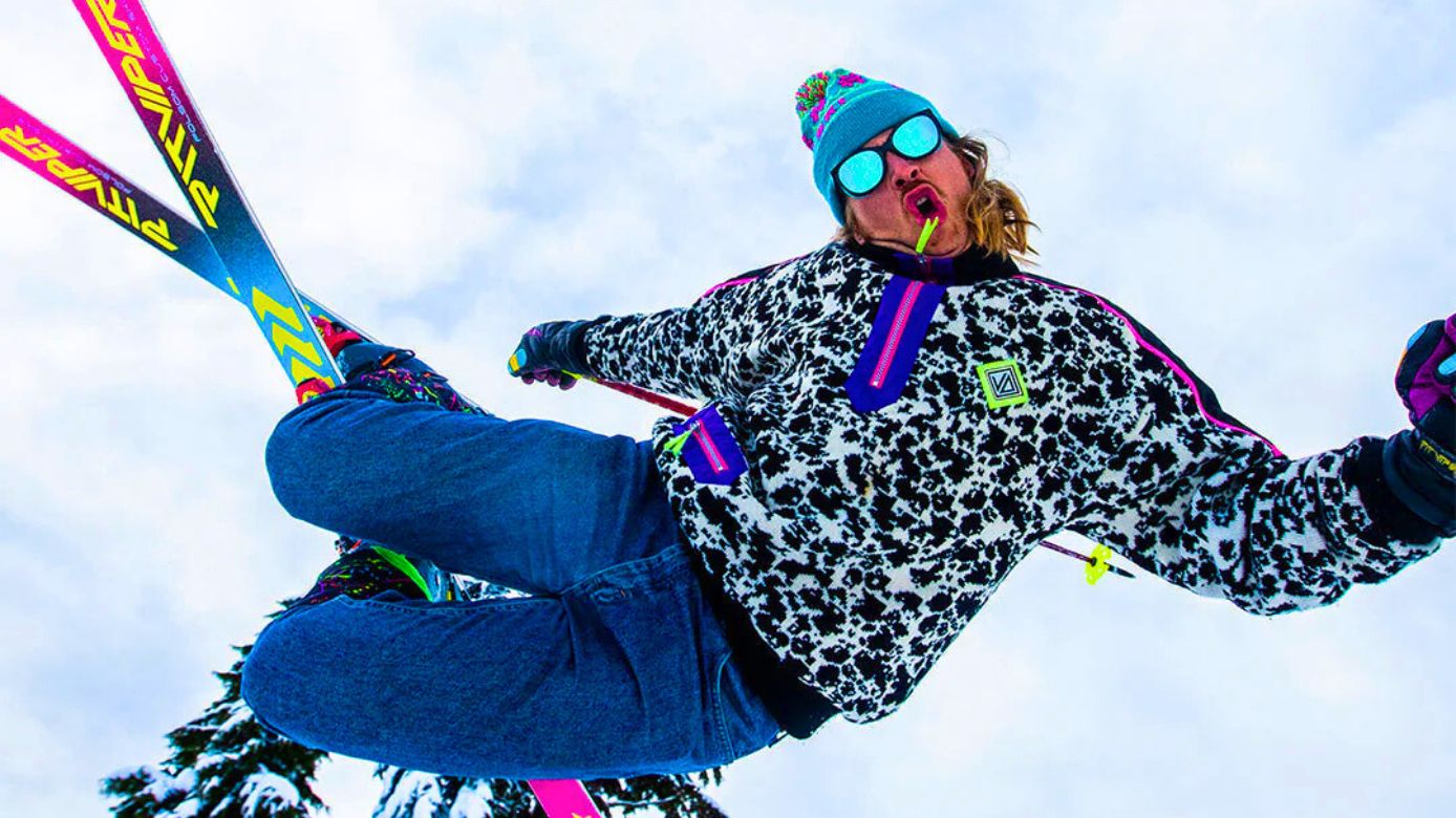 A snowboarder wearing Pit Vipers performing tricks.