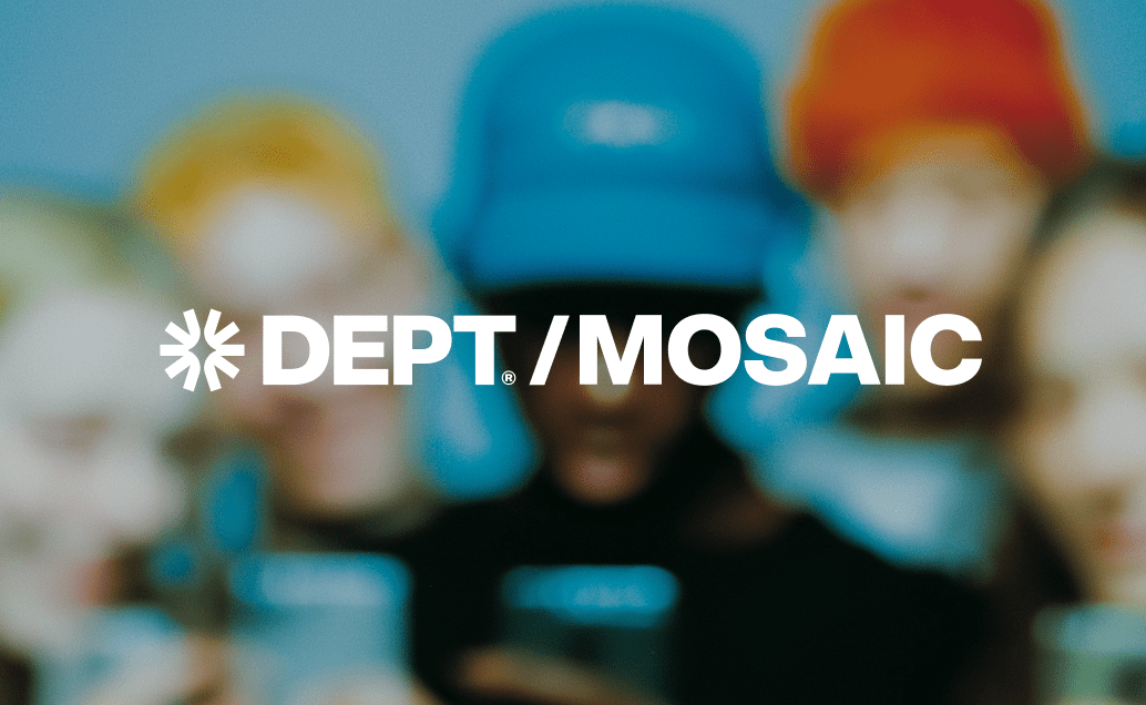 Logo for "DEPT/MOSAIC" in white against a blurred image of several diverse people, one wearing a blue hat, suggesting a focus on community and diversity.